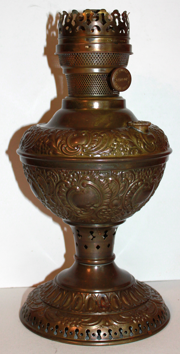 Beacon lamp with Beacon model 3 burner on a E. Miller & Co table font