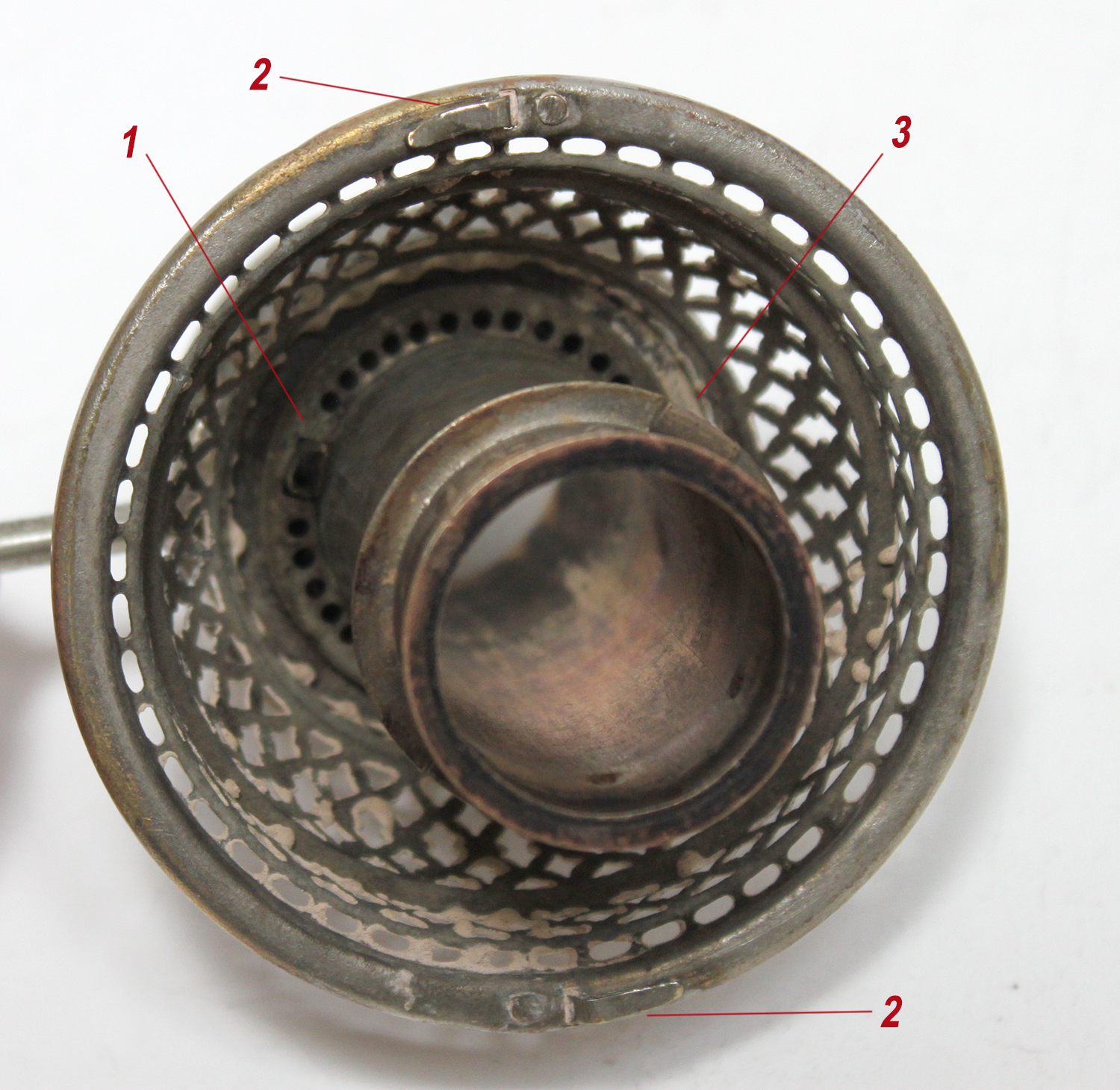 Looking down at a bare Ironclad lamp model 2 burner basket